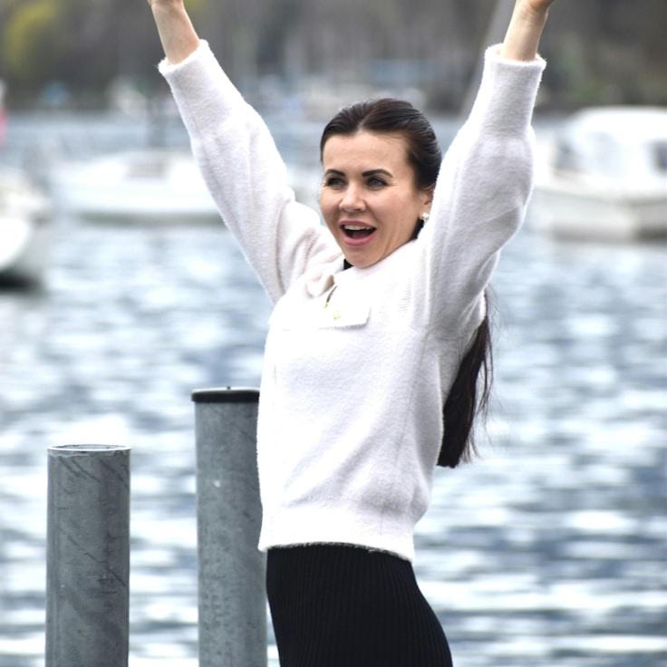 Mira Kapoor, Lead Design Curator at Cloud Beacon Path, reviewing corporate floral arrangements